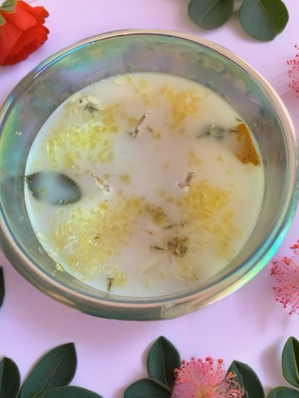 A 16 oz hand-poured Flower Ecstasy candle made with coconut apricot wax, featuring a fresh floral fragrance in an elegant glass jar.
